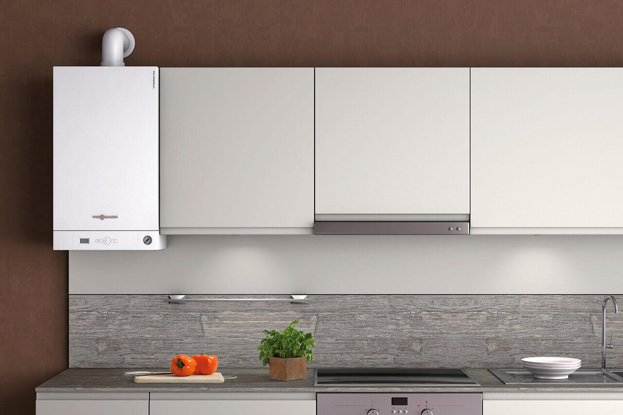 A condensing boiler amongst kitchen cabinets