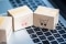 Wooden blocks with pictures of shopping carts lie on a keyboard