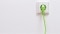 The picture shows a green power cable as a symbol for the use of green electricity with a wall heater