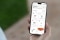 The image shows a smartphone with the ViCare app open on the screen 